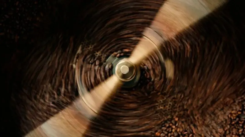 Coffee beans in a grinder