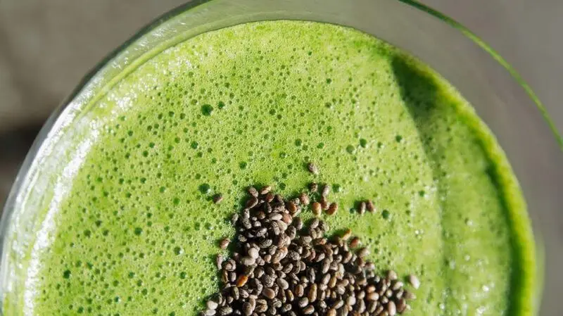 Green smoothie topped with chia seeds