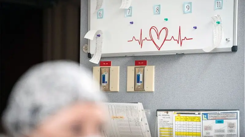 A whiteboard with heart health measurements in a doctor's office