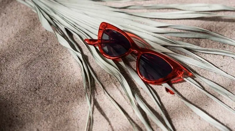 Red sunglasses in the sand