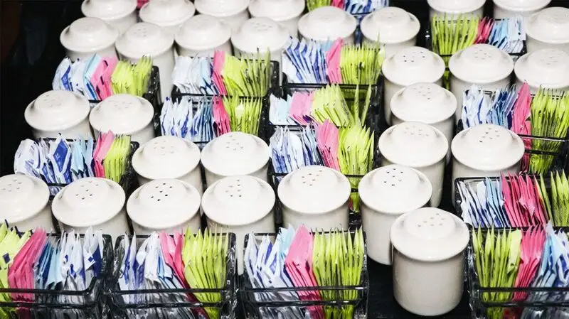 Food service tray with sugar packets, salt and pepper shakers