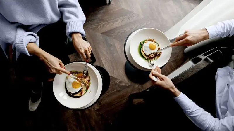 two dishes with sunny side up eggs seen from above