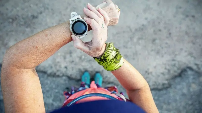 Overhead view of a person checking their smartwatch