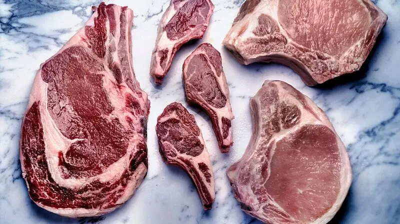 Cuts of red meat on a flat surface