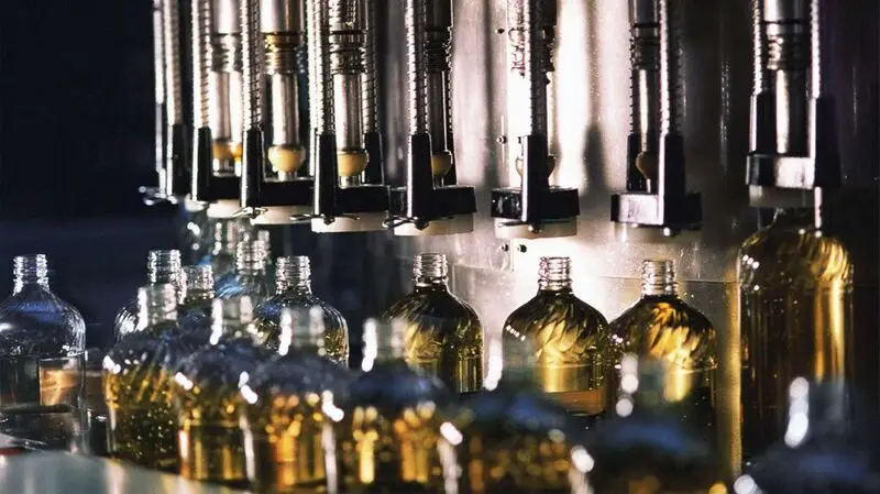 Bottles lined up to produce corn oil