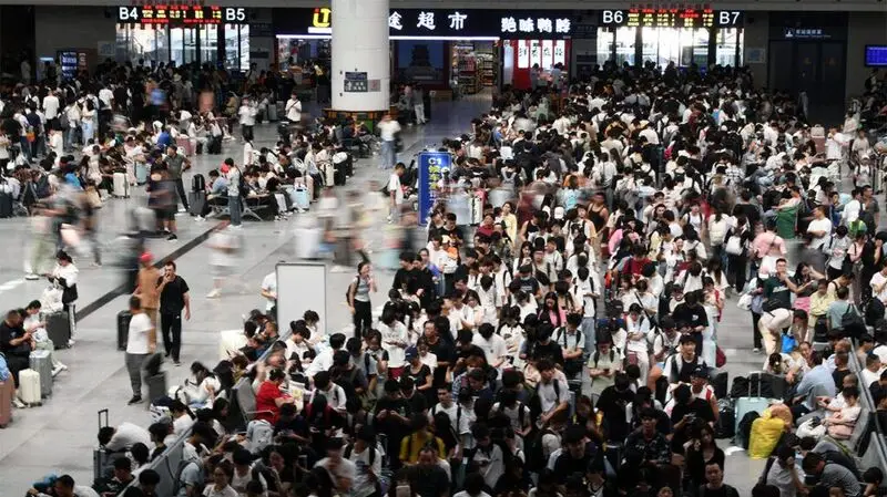 A crowd of people at a transport station in China