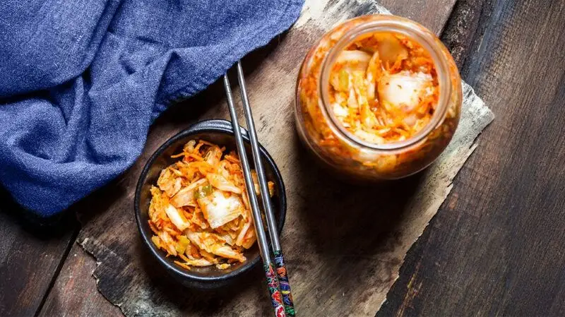 jar and bowl of kimchi