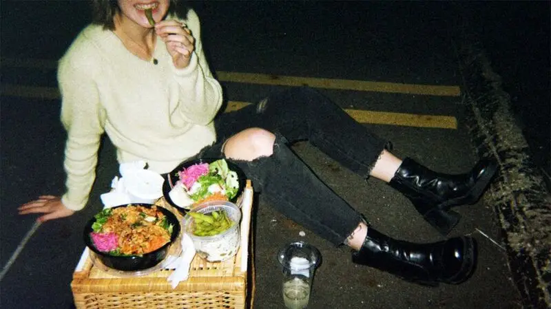 candid shot of person eating late at night