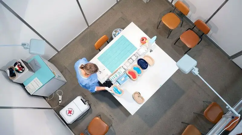 doctor in office, photographed from above