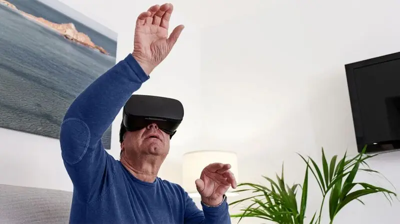 older white man wearing virtual headset