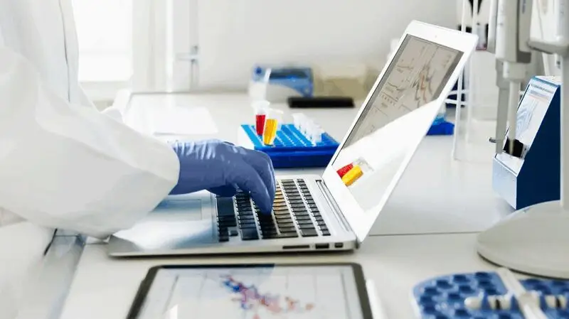 Medical researcher working on a laptop.