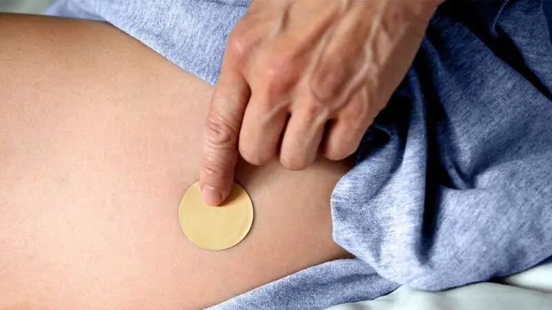 HRT patch on white person's skin