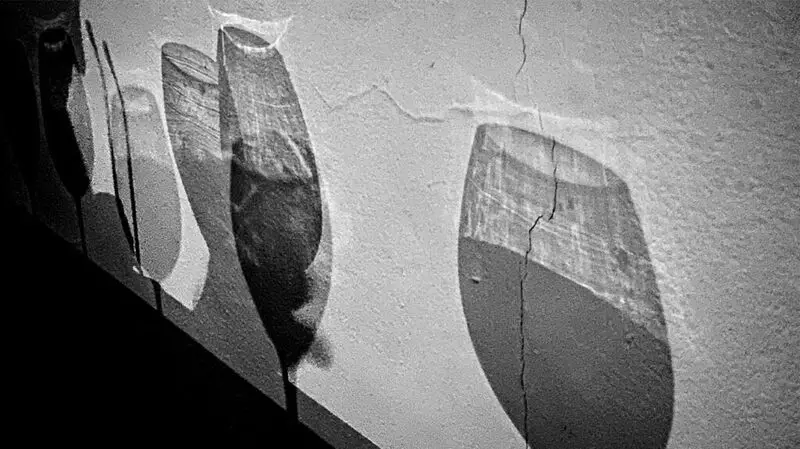 Shadows of wine glasses on the walls