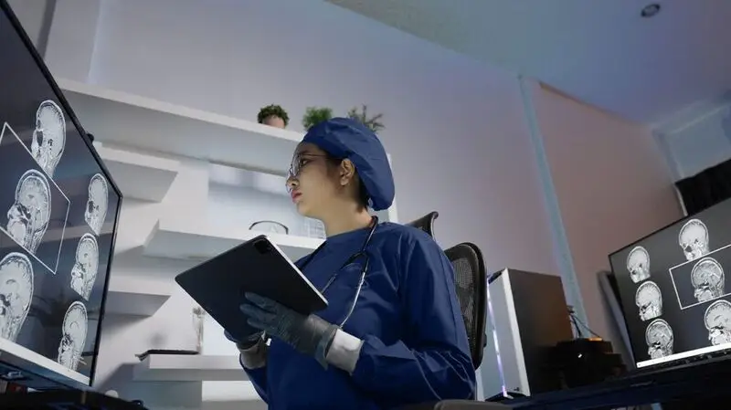 A doctor reviewing brain scans.