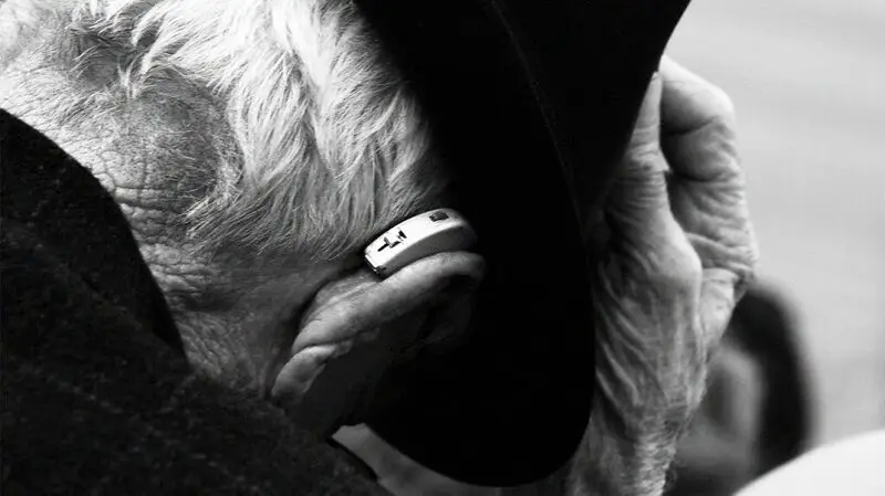 black and white closeup photo of hearing aid