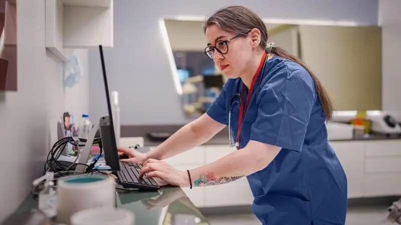 A medical researcher using a computer.