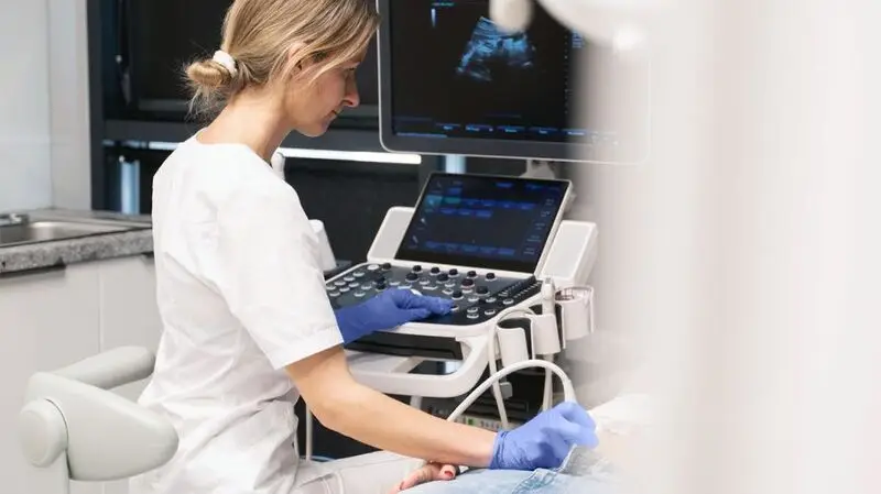 A healthcare professional giving a patient an ultrasound scan for endometriosis