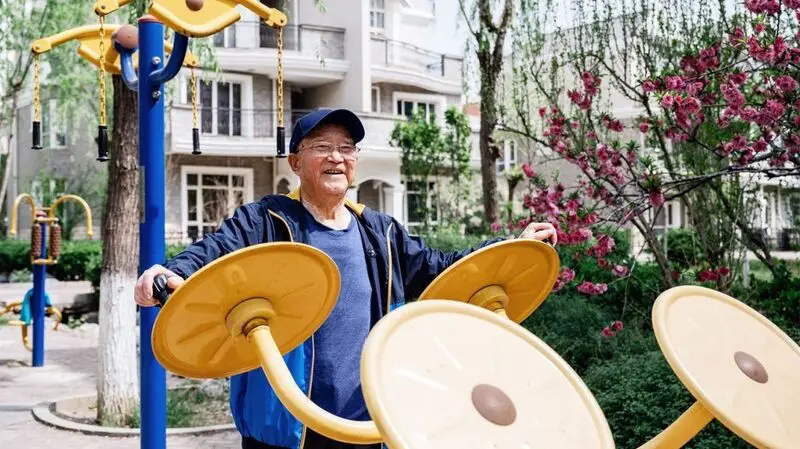 older man active at park gym