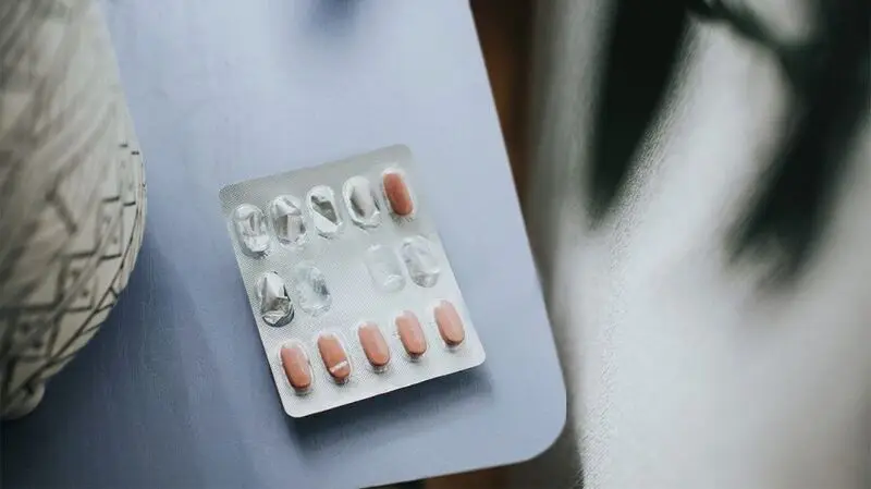 A half empty blister pack of beta blockers on a table