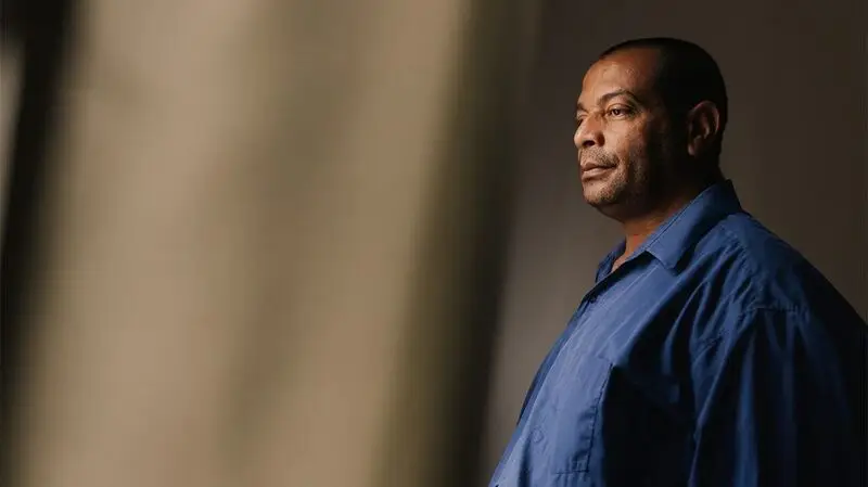 An older adult looking pensive.