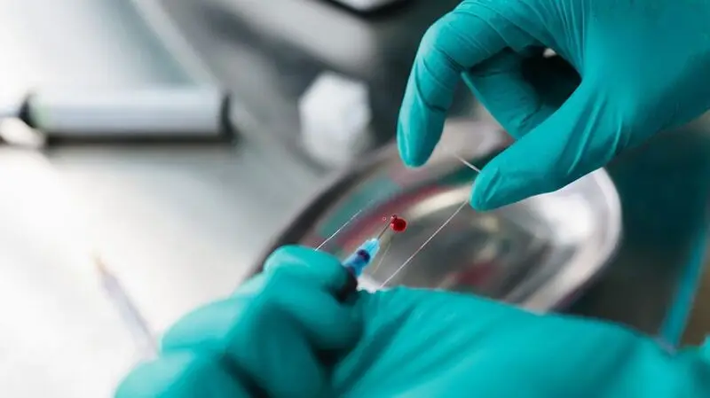 A lab technician preparing a blood sample.