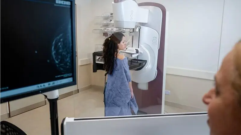 A person having a mammogram.