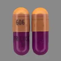 Prilosec (Omeprazole [ oh-mep-ra-zol ])-606 PRILOSEC 10-10 mg-Pink & Purple-Capsule-shape