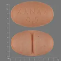 Xanax (Alprazolam [ al-pray-zoe-lam ])-XANAX 0.5-0.5 mg-Orange-Oval