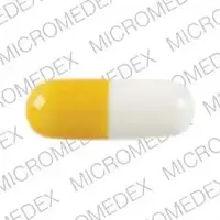 Strattera (Atomoxetine [ at-oh-mox-e-teen ])-LILLY 3238 18 mg-18 mg-Gold & White-Capsule-shape