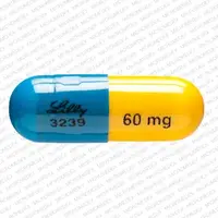 Strattera (Atomoxetine [ at-oh-mox-e-teen ])-LILLY 3239 60 mg-60 mg-Blue & Yellow-Capsule-shape