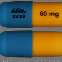 Strattera (Atomoxetine [ at-oh-mox-e-teen ])-LILLY 3239 60 mg-60 mg-Blue & Yellow-Capsule-shape