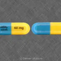 Strattera (Atomoxetine [ at-oh-mox-e-teen ])-LILLY 3239 60 mg-60 mg-Blue & Yellow-Capsule-shape