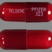 Feldene (Piroxicam [ peer-ox-i-kam ])-FELDENE PFIZER323-20 mg-Red-Capsule-shape