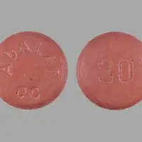 Adalat cc (Nifedipine [ nye-fed-i-peen ])-ADALAT CC 30-30 mg-Pink-Round