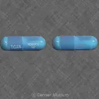 Tigan (oral/injection) (Trimethobenzamide (oral/injection) [ trye-meth-oh-benz-a-mide ])-TIGAN ROBERTS 187-250 mg-Blue-Capsule-shape