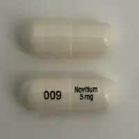 Nitisinone (Nitisinone [ nye-tis-i-none ])-009 Novitium 5 mg-5 mg-White-Capsule-shape