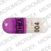 Nitroglycerin (topical) (Nitroglycerin (topical) [ nye-troe-glis-er-in ])-ETHEX 004-2.5 mg-Purple / Clear-Capsule-shape