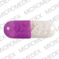 Nitroglycerin (topical) (Nitroglycerin (topical) [ nye-troe-glis-er-in ])-ETHEX 004-2.5 mg-Purple / Clear-Capsule-shape