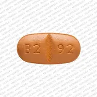 Oxcarbazepine (Oxcarbazepine [ ox-kar-bay-zeh-peen ])-B2 92-150 mg-Beige-Oval