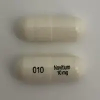 Nitisinone (Nitisinone [ nye-tis-i-none ])-010 Novitium 10 mg-10 mg-White-Capsule-shape