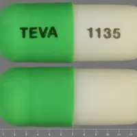 Acitretin (Acitretin [ a-si-tre-tin ])-TEVA 1135-10 mg-Green & White-Capsule-shape