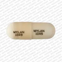 Doxepin (systemic) (monograph) (Sinequan)-MYLAN 1049 MYLAN 1049-10 mg-White-Capsule-shape