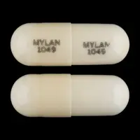 Doxepin (systemic) (monograph) (Sinequan)-MYLAN 1049 MYLAN 1049-10 mg-White-Capsule-shape