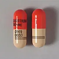 Dantrolene (Dantrolene (oral) [ dan-troe-leen ])-DANTRIUM 100mg 0149 0033-100 mg-Brown & Orange-Capsule-shape