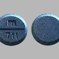 Levodopa/carbidopa (monograph) (Medically reviewed)-m 711-10 mg / 100 mg-Blue-Round