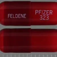 Piroxicam (Piroxicam [ peer-ox-i-kam ])-FELDENE PFIZER 323-20 mg-Red-Capsule-shape