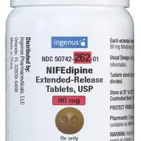 Nifedipine (eqv-adalat cc) (Nifedipine [ nye-fed-i-peen ])-90-90 mg-Brown-Round