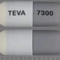 Minocycline (systemic) (monograph) (Dynacin)-TEVA 7300-75 mg-Gray & White-Capsule-shape